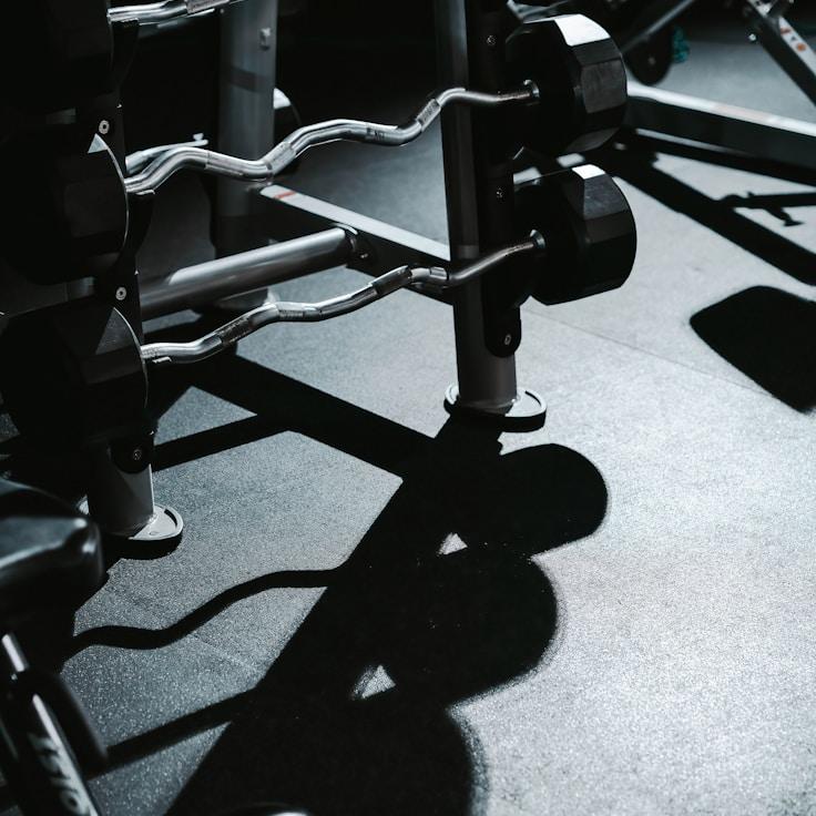Interior of a professional gym with weight training equipment and mirrors